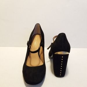 Black suede Mary Jean pump.